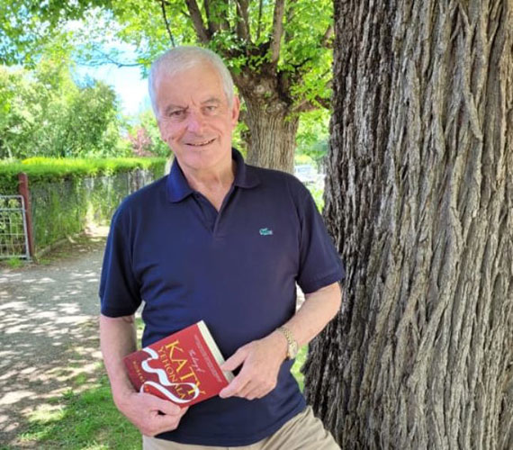 Author Robert Barclay standing by tree