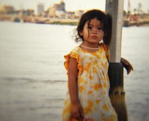 youn asian girl standing by river for the sunlight foundation