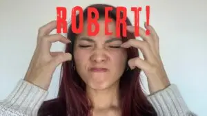 Angry young Asian woman with hands raised from Robert Barclay's novel