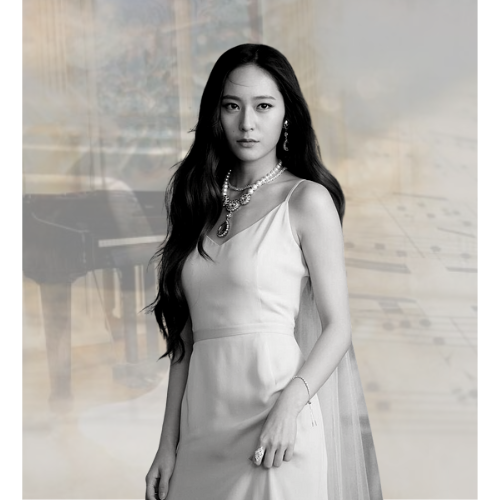 Asian woman in white dress in front of piano