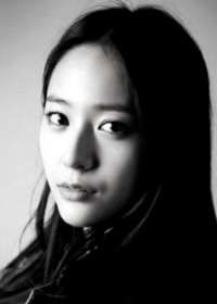 Clara Yehonala portrait Pretty young Asian woman head and shoulders looking at camera