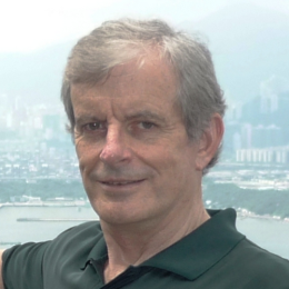 head and shoulders of older western man in green shirt